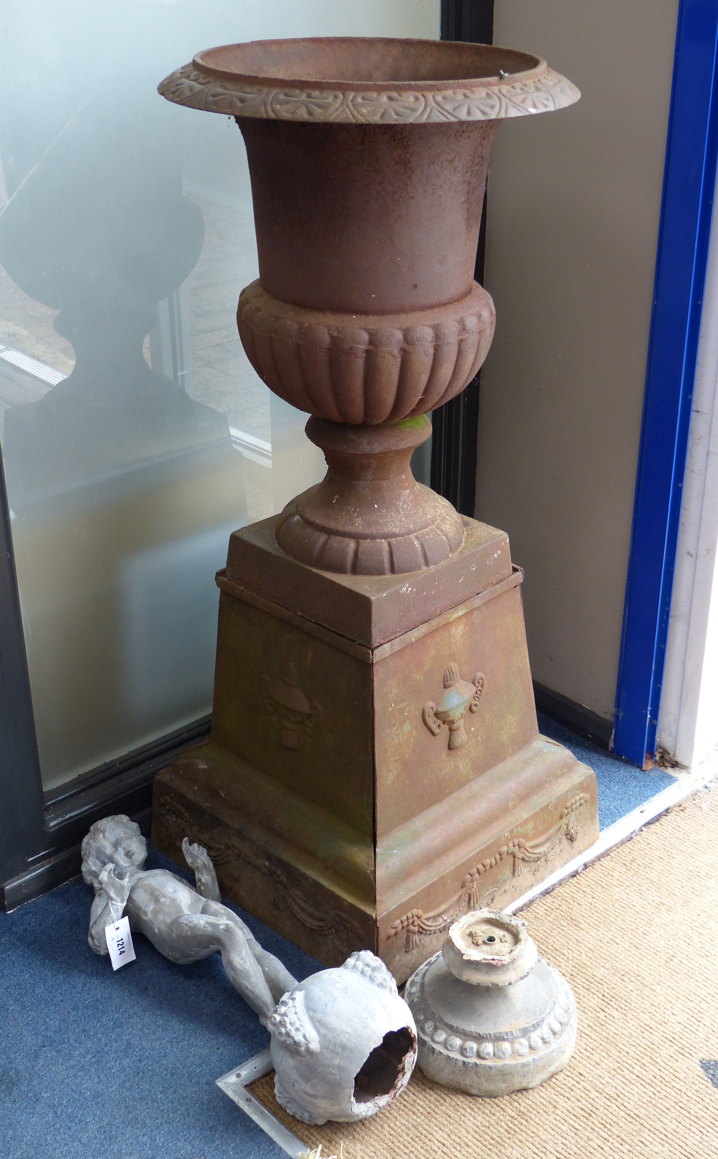 A Victorian lead garden ornament of a putto on orb, height 80cm